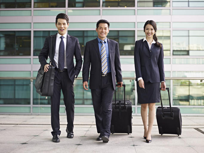 business people traveling with luggages.