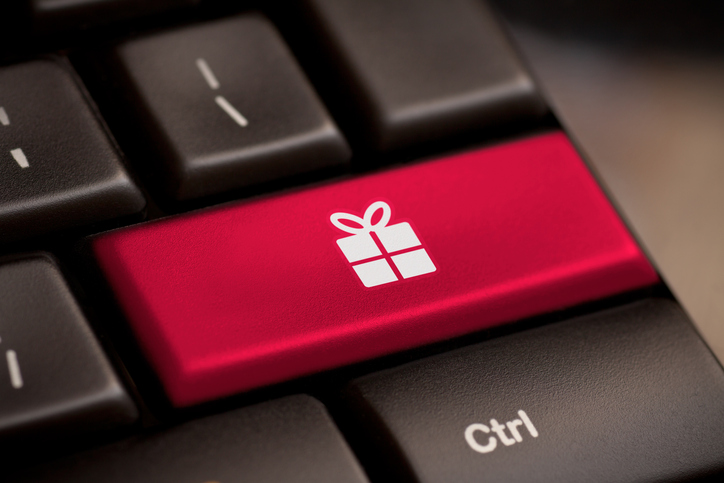 Christmas key with gift box icon on laptop keyboard