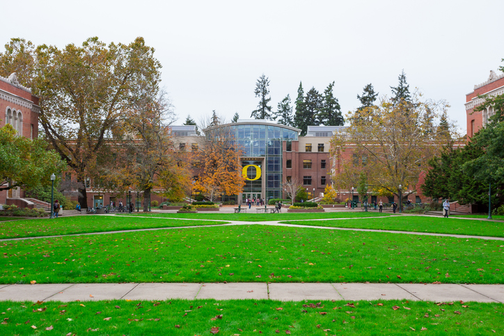 Eugene, OR - October 25, 2016: Students walk across the quad courtyard area at the University of Oregon during a break between classes.